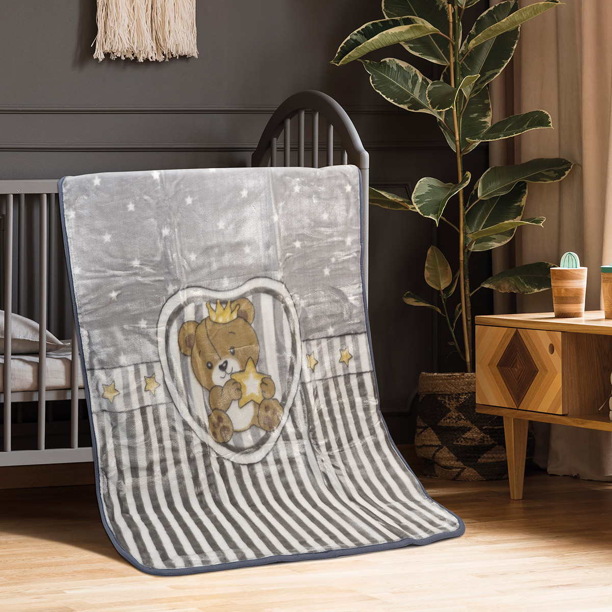 Real,Photo,Of,A,Cot,With,A,Yellow,Blanket,Standing